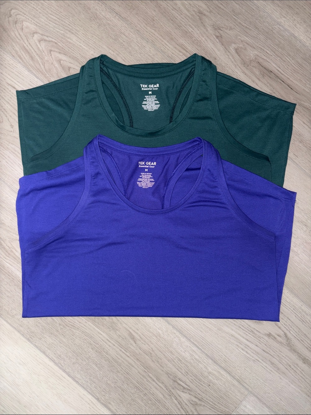 Two Tek Gear activewear shirts. Dark Purple and Deep Green